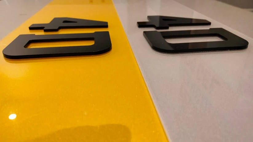 A detailed close-up shot of the laser-cut characters on a 4D number plate.