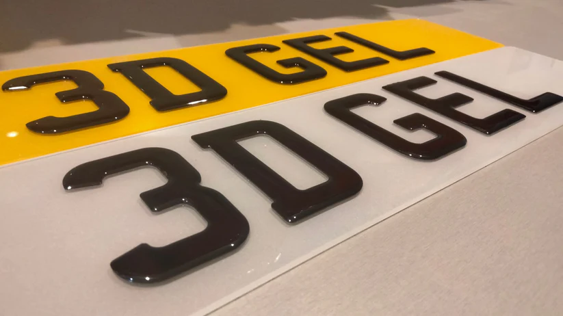 A detailed close-up shot of the glossy characters on a 3D gel number plate.